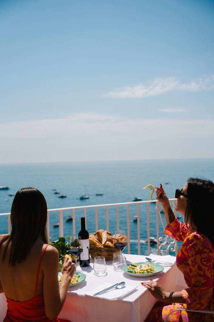 Guests enjoying lunch with a view of the Mediterranean